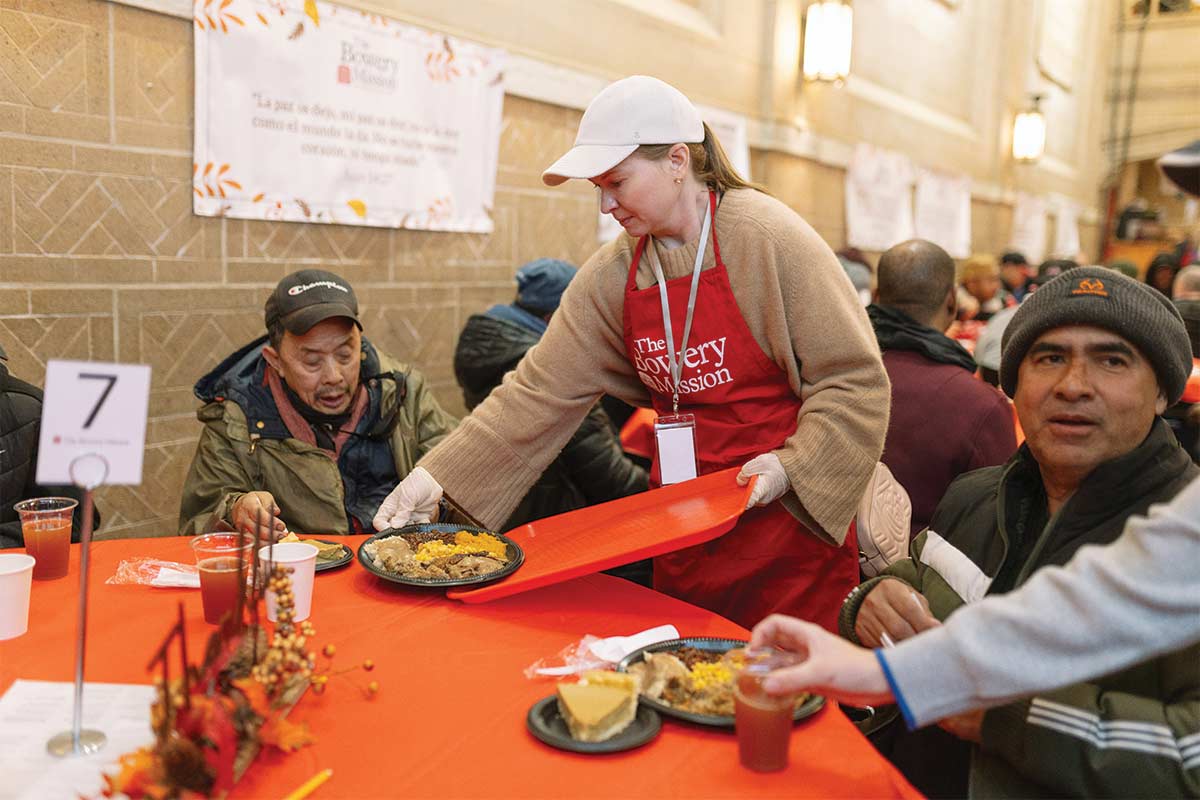 Guests receiving Thanksgiving meal